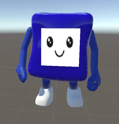 La mascotte dans Unity&nbsp;: un corps cubique bleu, un visage blanc aux yeux noirs et au sourire, des chaussures blanches.